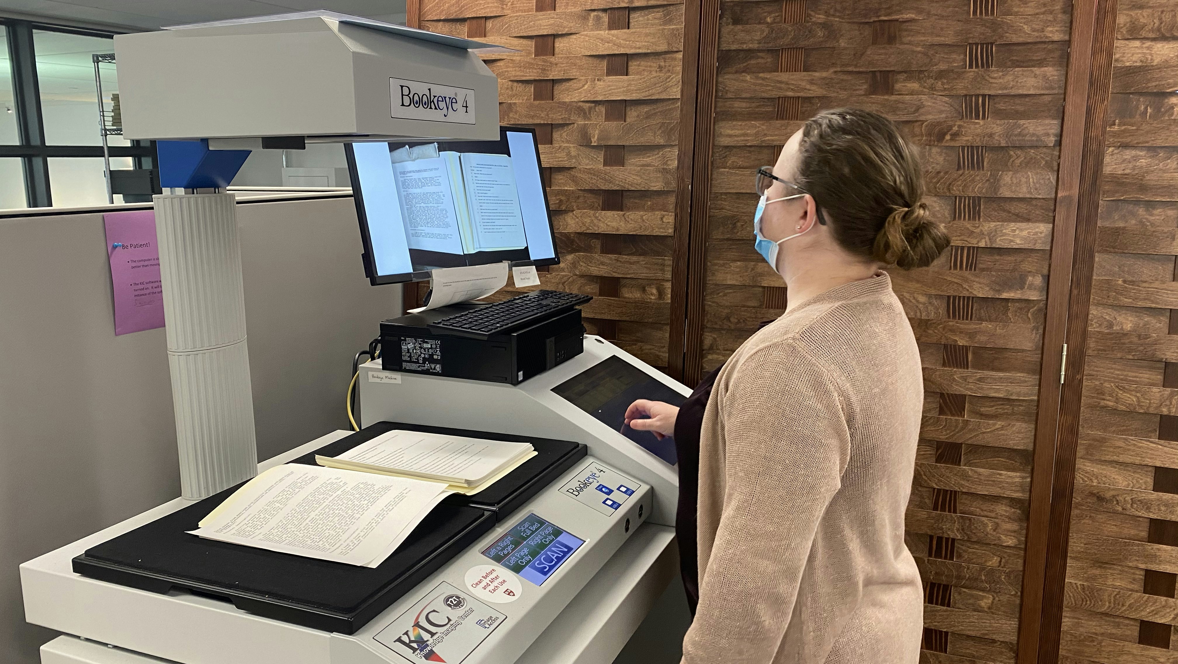 Catherine Lea Holbrook scanning documents in the Schlesinger Library