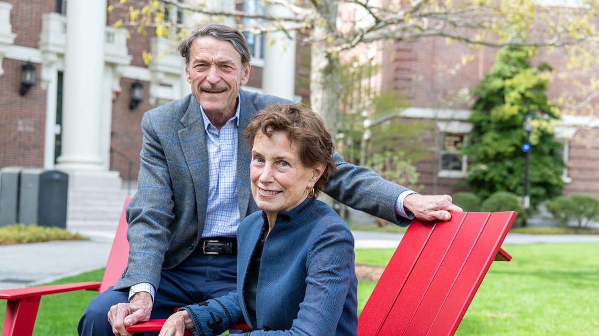 Melanie and David Niemiec sit in Adirondack chairs