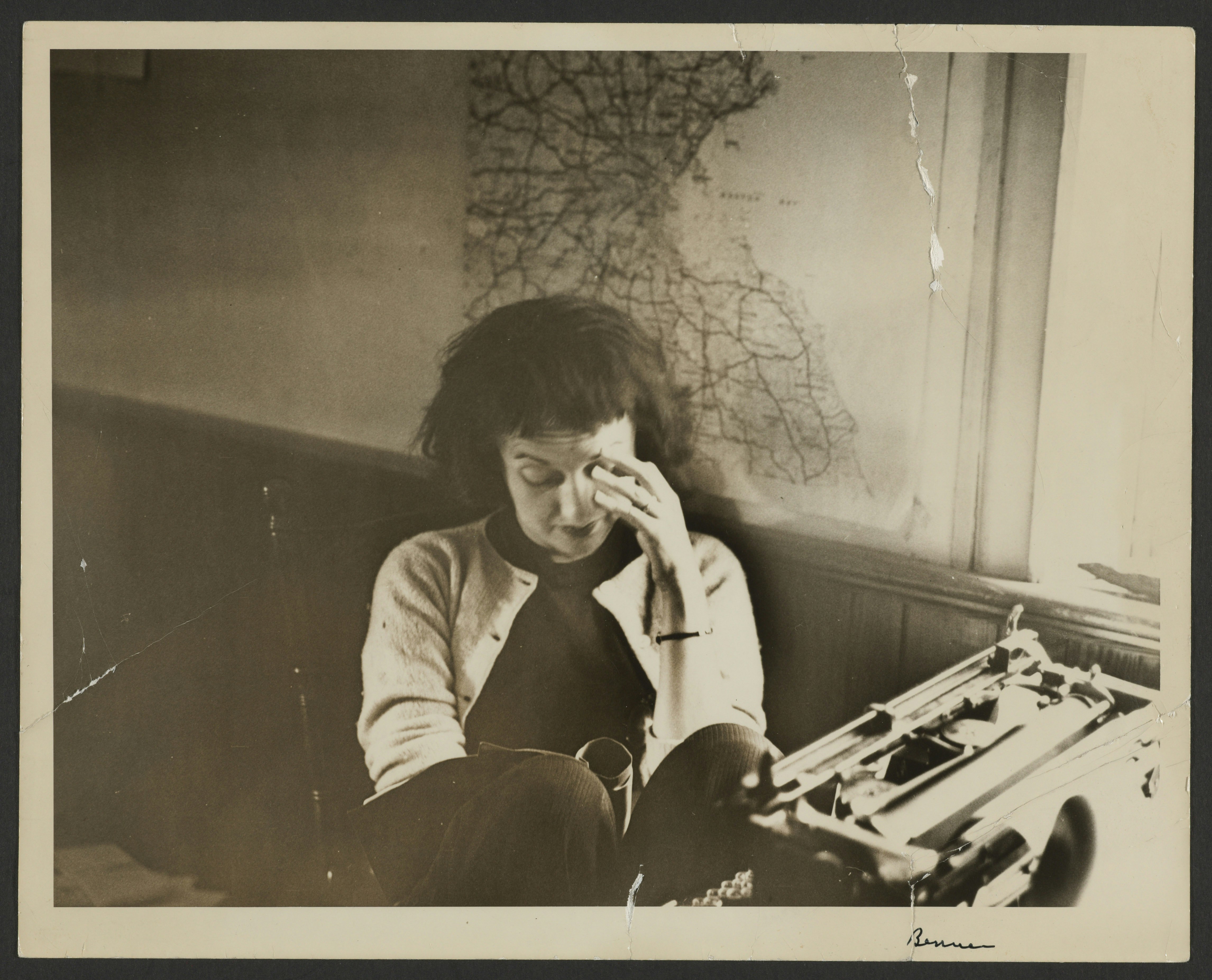 Portrait of Betty Friedan working at a desk with a typewriter