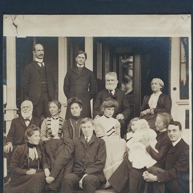 Group portrait of members of the Blackwell family on a dwelling porch