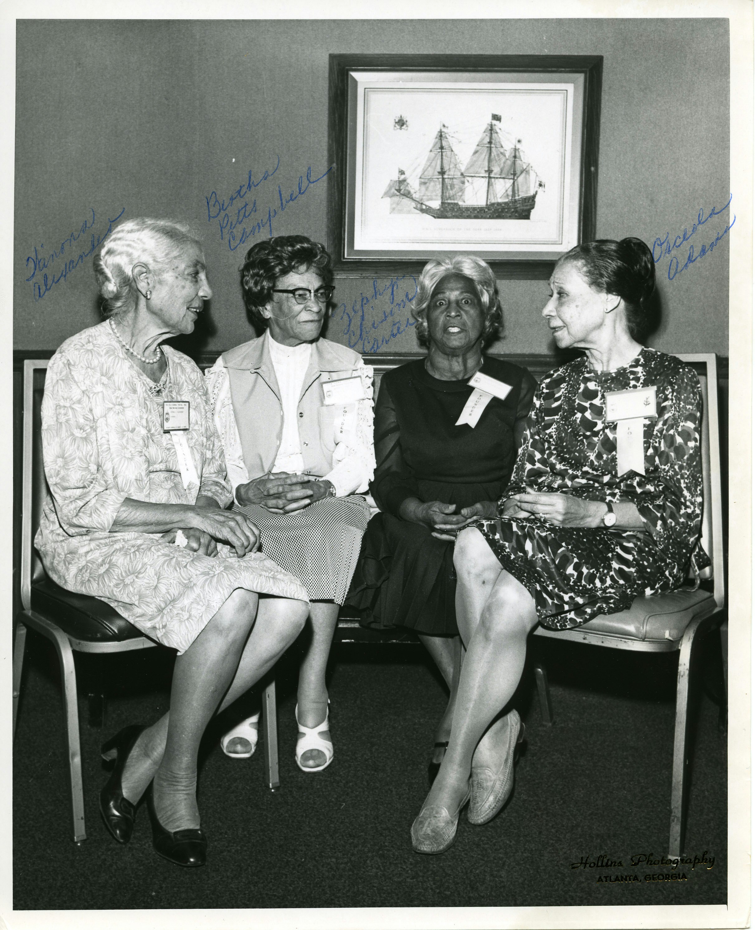 Group portrait of four Delta Sigma Theta members, Winona Alexander, Bertha Pitts Campbell, Zephyr Chisom Carter, and Orceola Adams, seated at an unknown event
