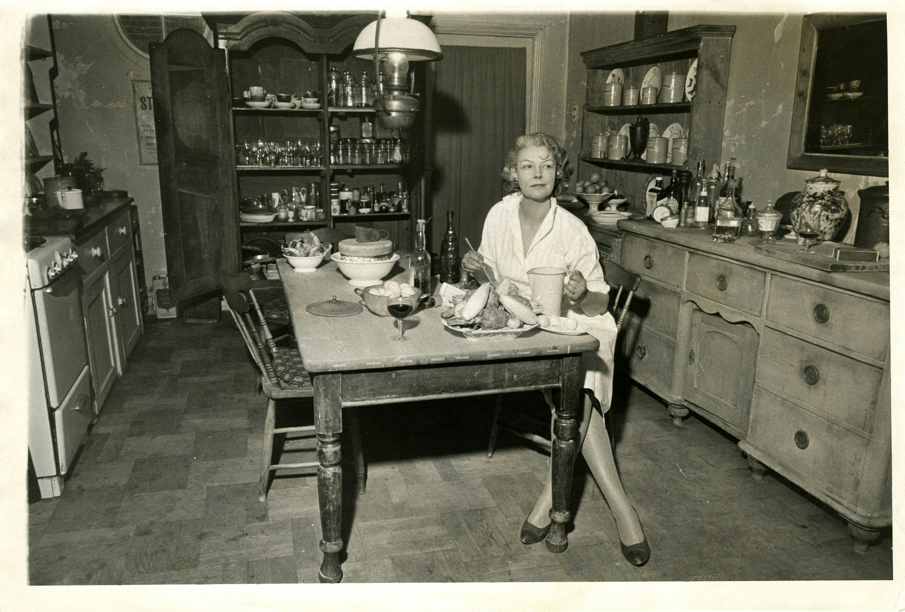 Elizabeth David sitting at the table in her kitchen