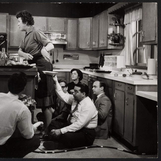 Julia Child filming a 1964 promo with four others at the Cambridge Gas and Electric Kitchen