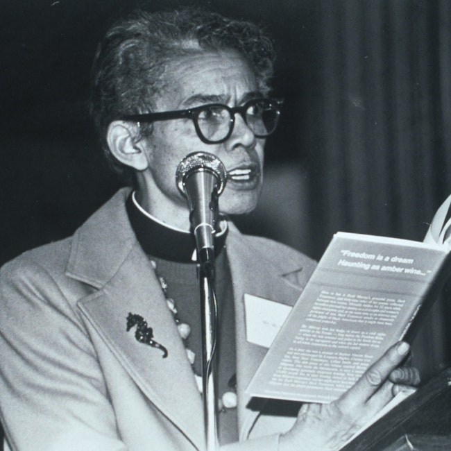 Pauli Murray standing in front of a microphone, reading from Dark Testament and Other Poems