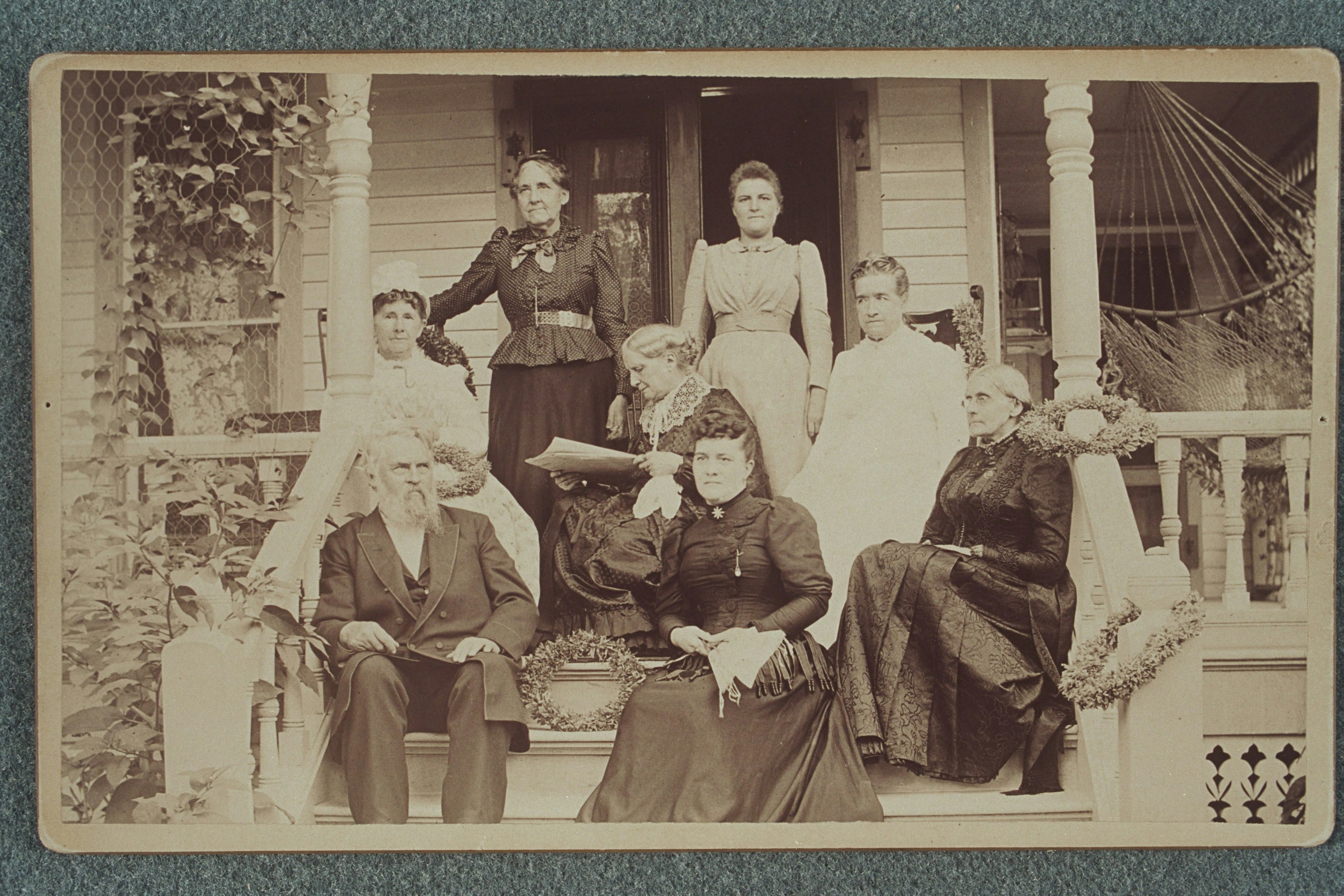 Susan B. Anthony and others, possibly members of the Anthony family, on porch