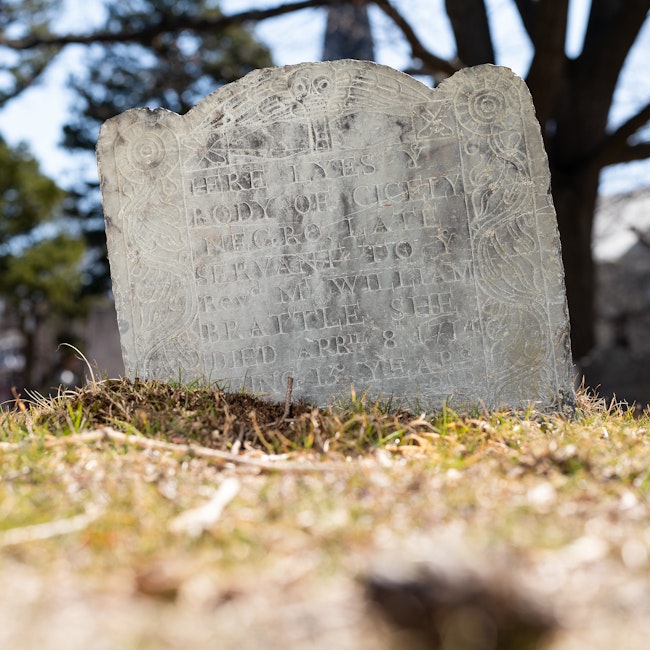 Tombstone in Mt. Auburn Cemetery that reads, “Here lyes ye body of Cecily, negro, late servant to ye Reverend Mr. William Brattle. She died April 8, 1714, being 13 years old.”