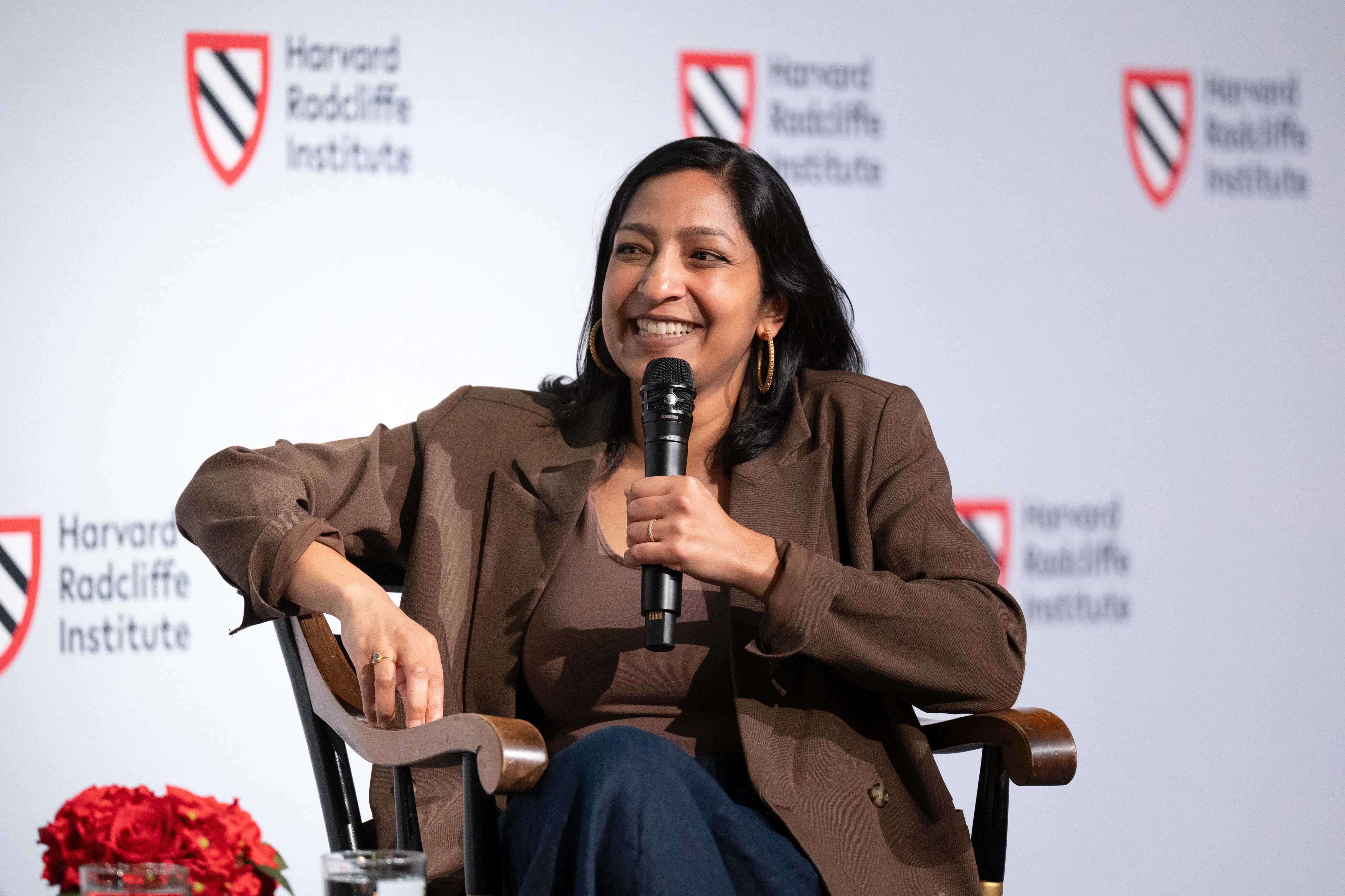 Woman speaking on stage in lecture hall