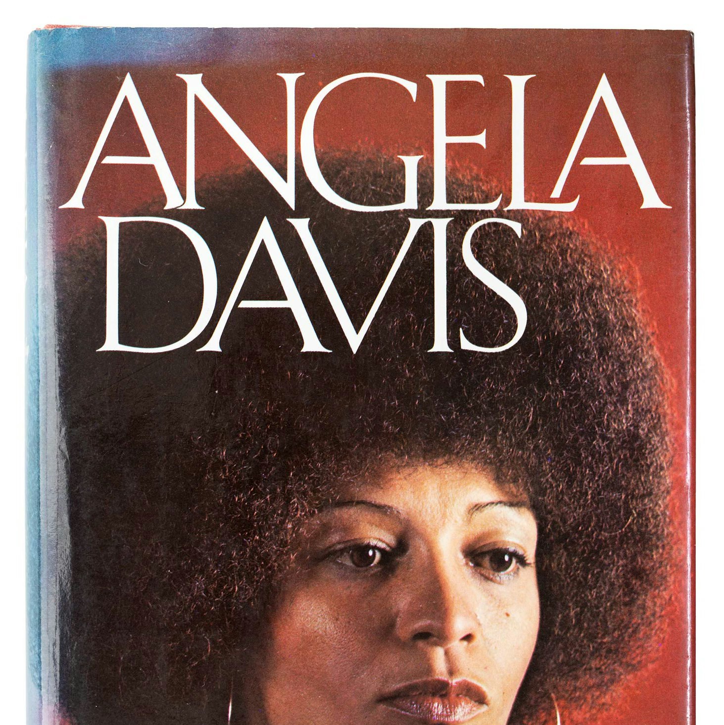 Headshot of Angela Davis with red backdrop.