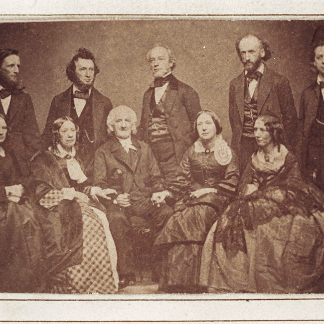 Group portrait of the Beecher family. Standing from left to right Thomas, William, Edward, Charles, Henry Ward, and seated from left to right, Isabella, Catherine, Lyman, Mary, and Harriet
