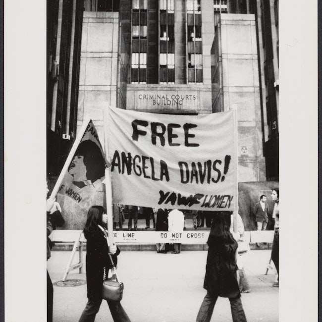 Women holding a "Free Angela Davis" banner