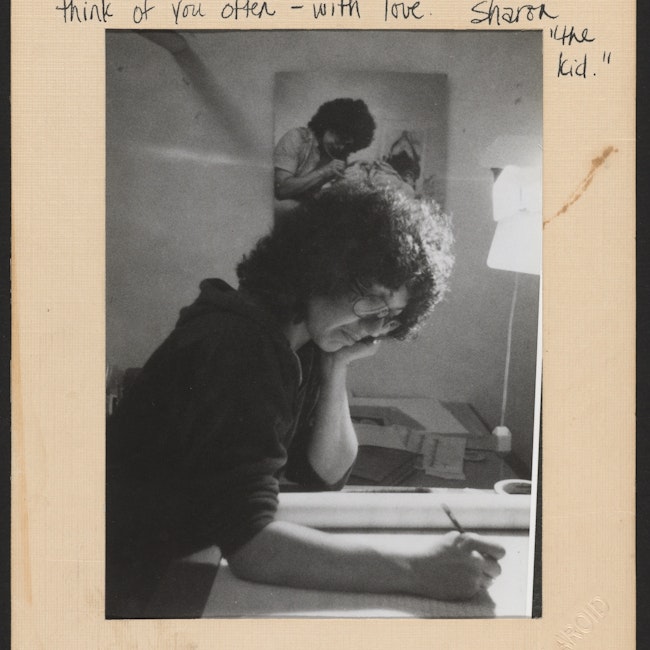 Judy Chicago writing at her desk