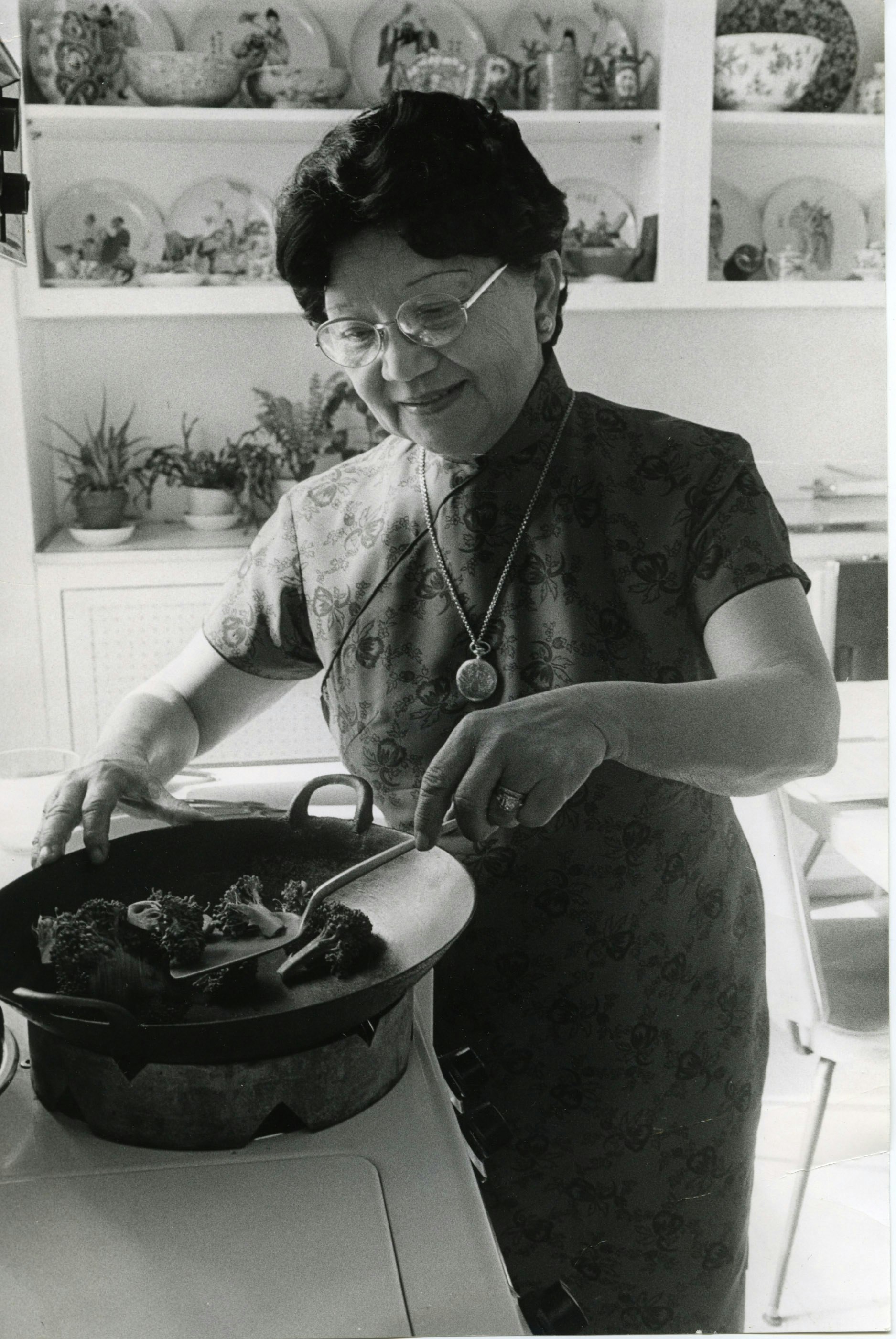 Grace Zia Chu stir frying broccoli