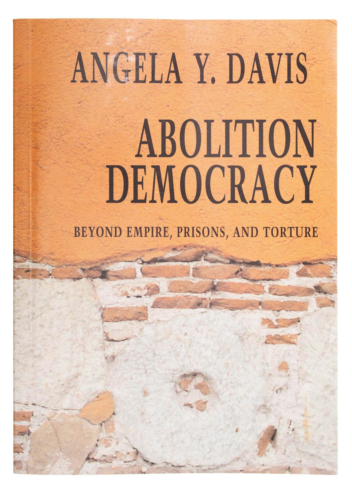 Angela Davis Bookcover, "Abolition Democracy." Bookcover illustration consists of a brick wall.