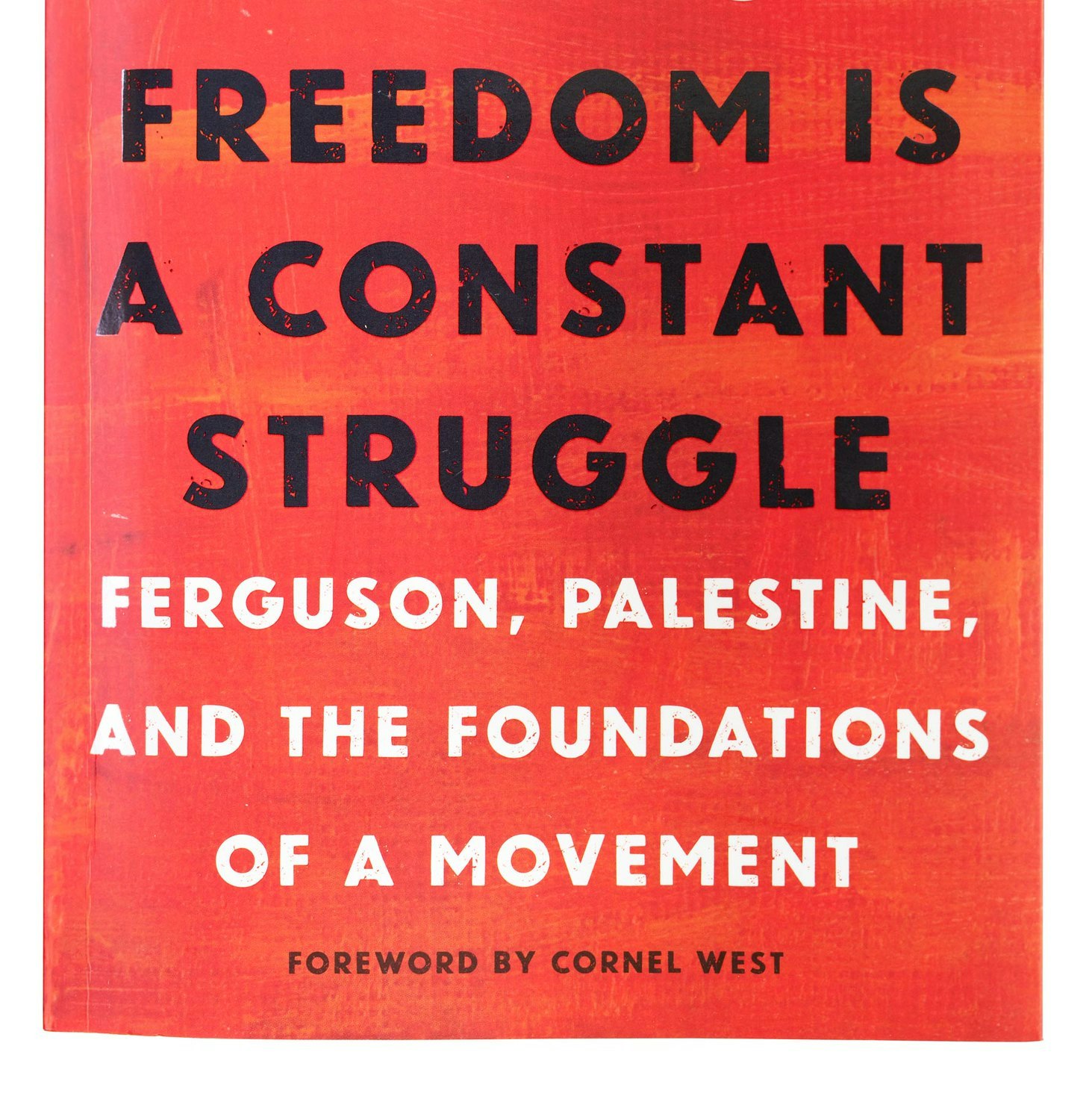 Red book cover for Angela Davis' "Freedom is a Constant Struggle."