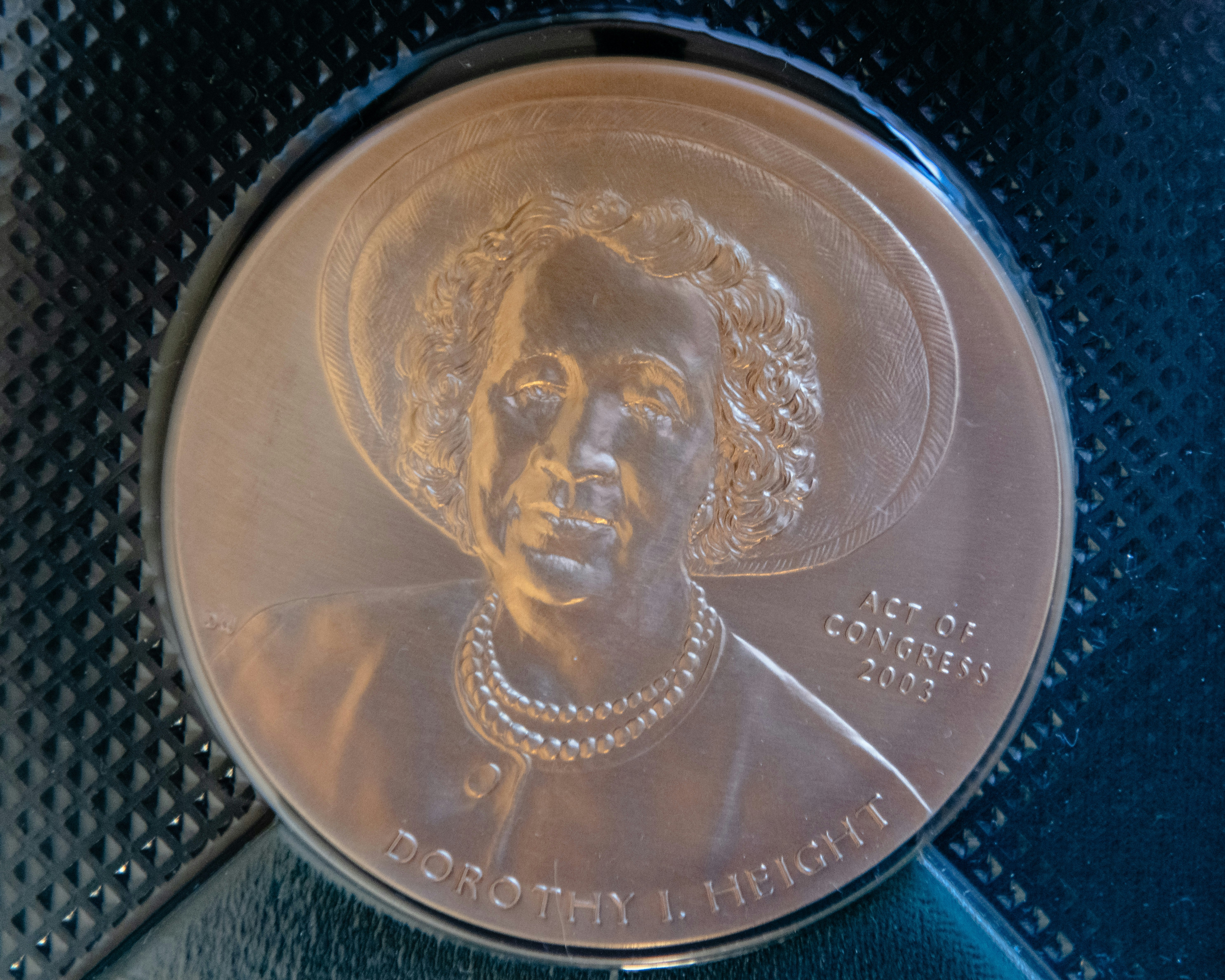 Dorothy Height's Medal of Freedom is a light copper and bears her embossed name and likeness, along with the words "Act of Congress, 2003."