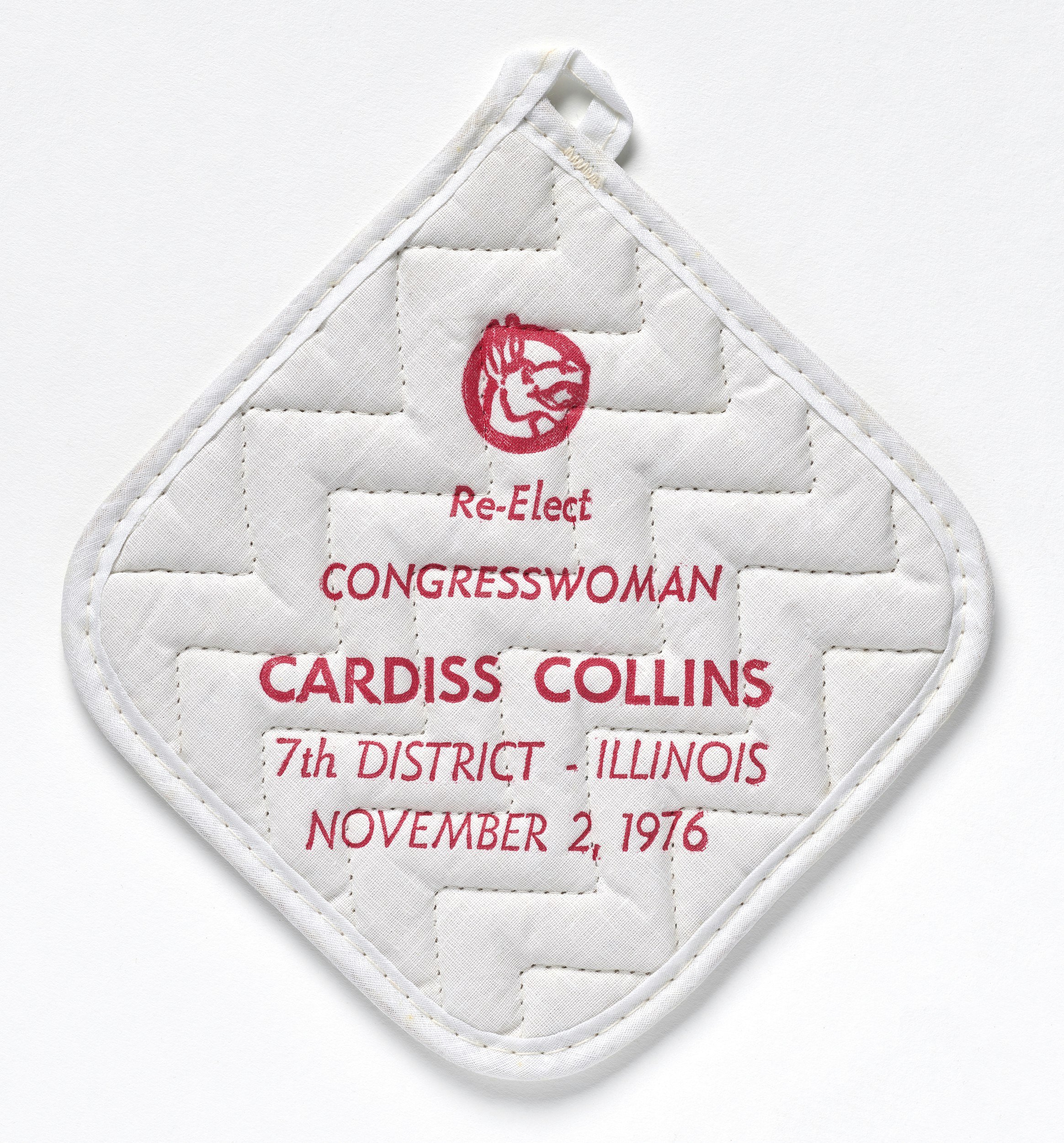 Square white with brown floral back and red text reading, "Re-Elect Congresswoman Cardiss Collins 7th Discrict-Illinois, November 2, 1976" under image of smiling donkey inside a circle.