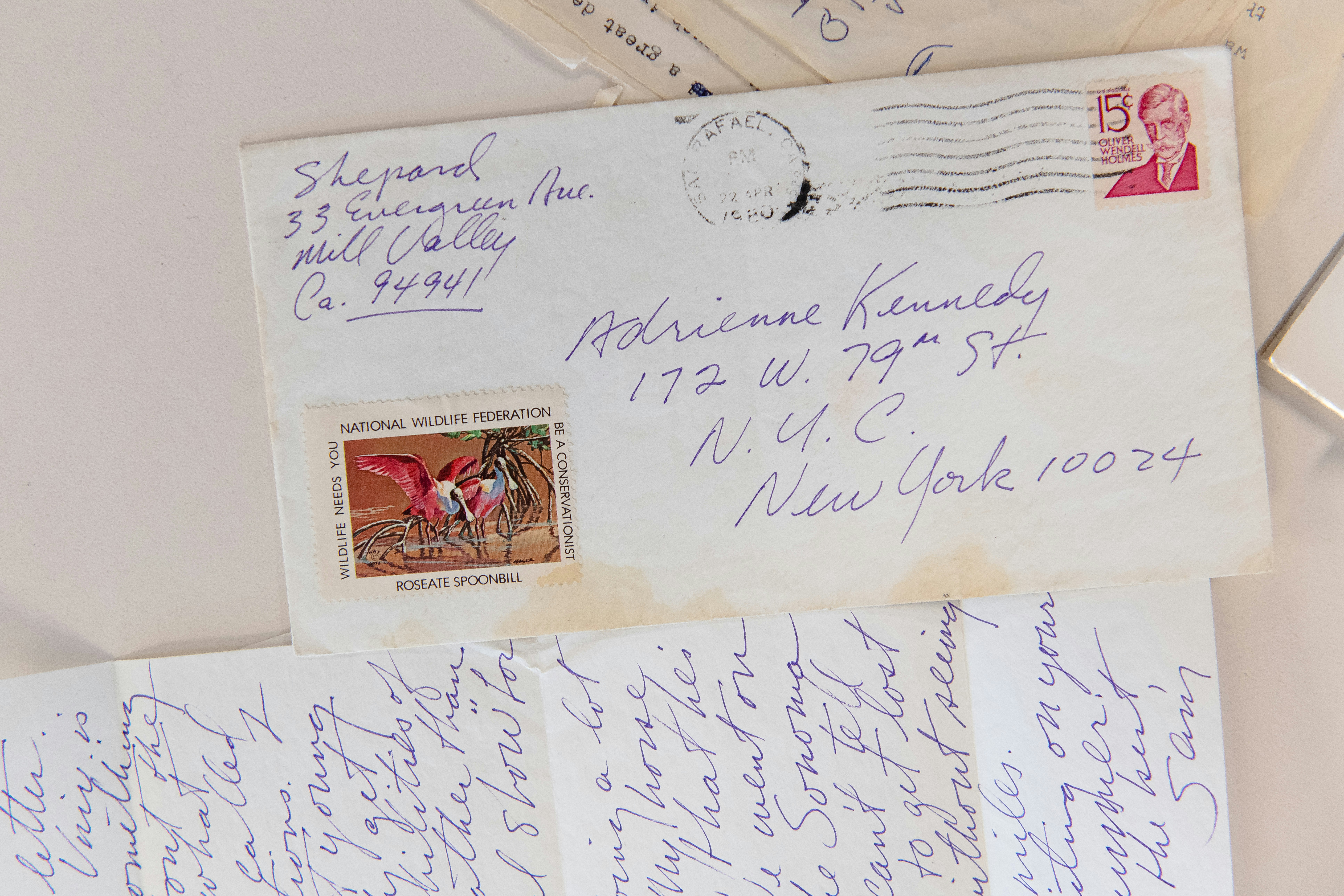 A handwritten letter and its postmarked envelope. The 15-cent stamp features Oliver Wendell Holmes.