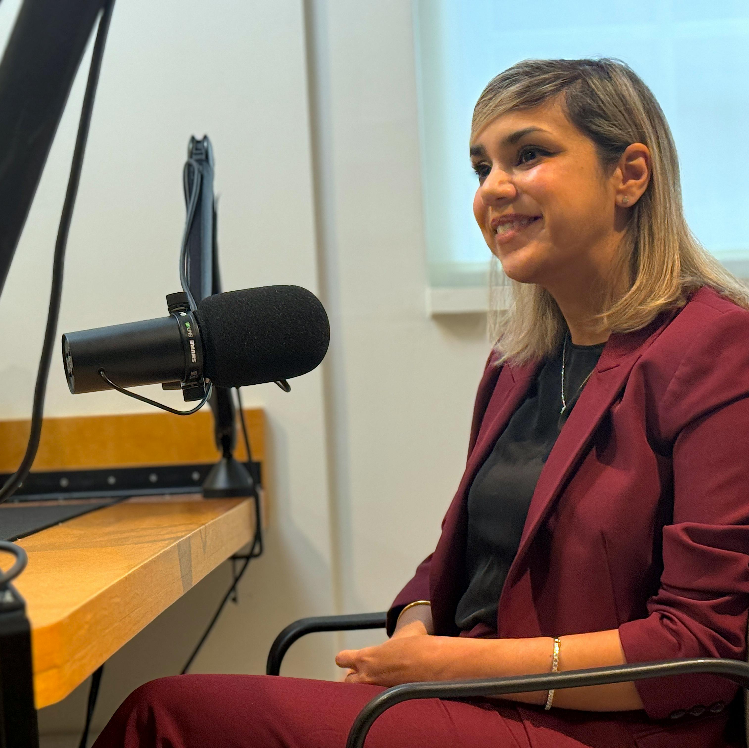 Portrait of Ashwini Nadkarni in podcast studio